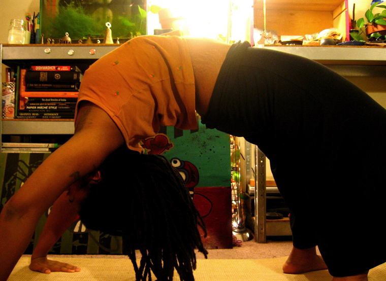 A person stretching in morning light
